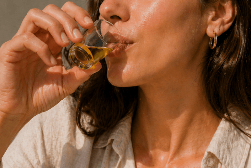 A woman taking an Alya shot